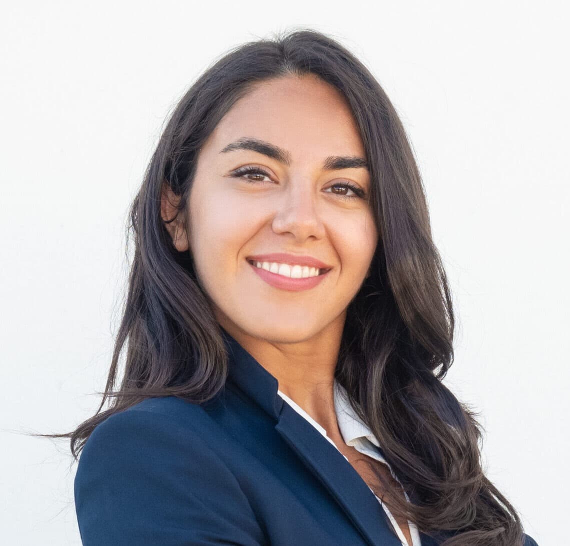 Smiling confident businesswoman posing with arms folded