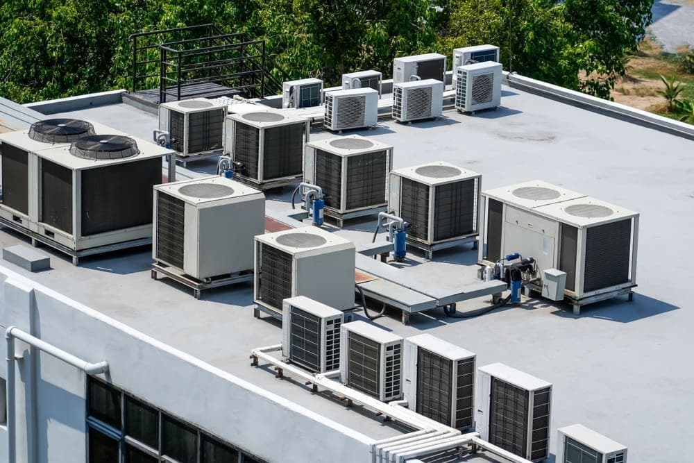 Commercial HVAC system serving a large building, supported by Auralis AI service agents